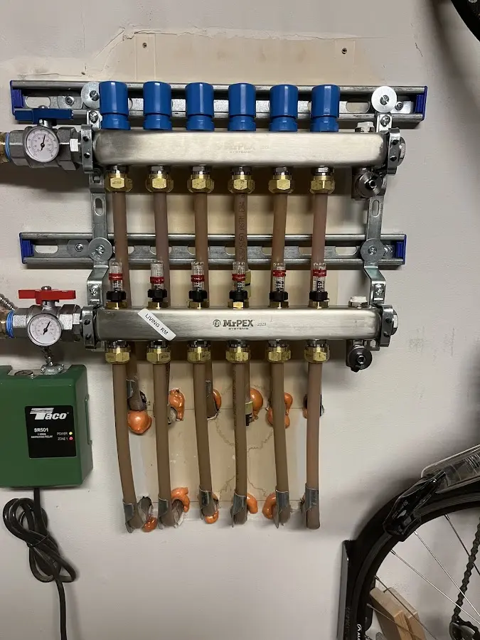 Plumber performing Water Heater Repair at a residential property in Hitchcock